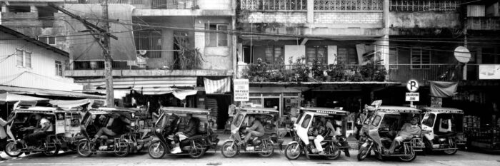 trikes in the philippines lining the street