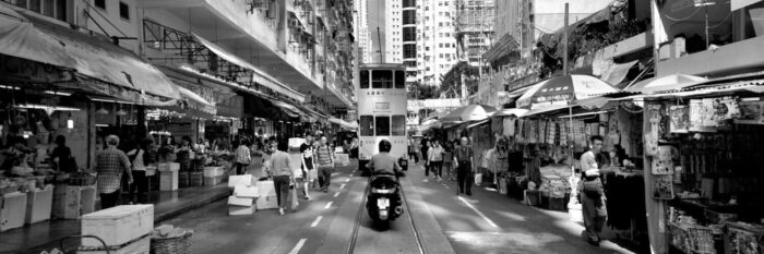 Tram passing through the market in Hong Kong Island