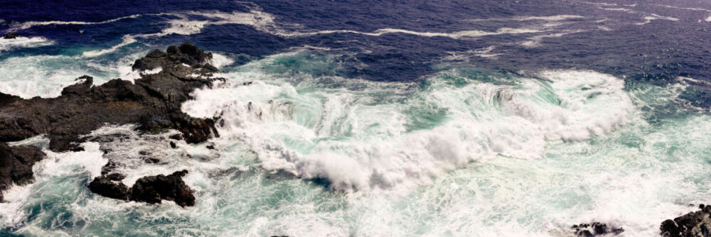 waves crashing against the rocks