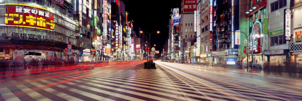 Tokyo Street Crossing at Night with traffic light trails