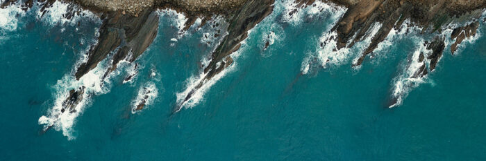 jagged rocky coast drone