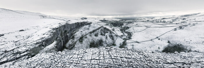 a panoramic print of Malham cover in North Yorkshire Dales covered in snow