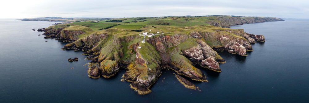 Scottish rugged coast and lighthouse