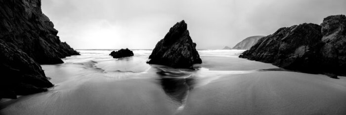 black and white panoramic print of coumeenole beach as the tide comes in