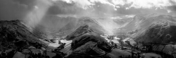 two valleys during a rain storm in martingale lake district b&w