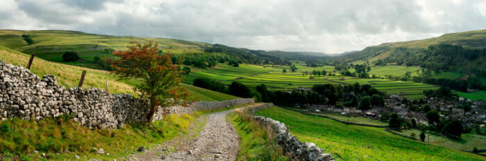 Winding country stone road Yorkshire Dales
