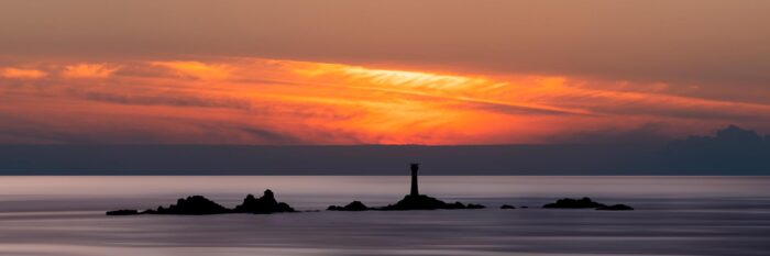 Panorama of Land's End and Longships lighthouse along the south west coastal path in Cornwall