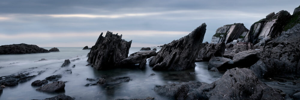 Panorama of the dramatic slate Devon coast