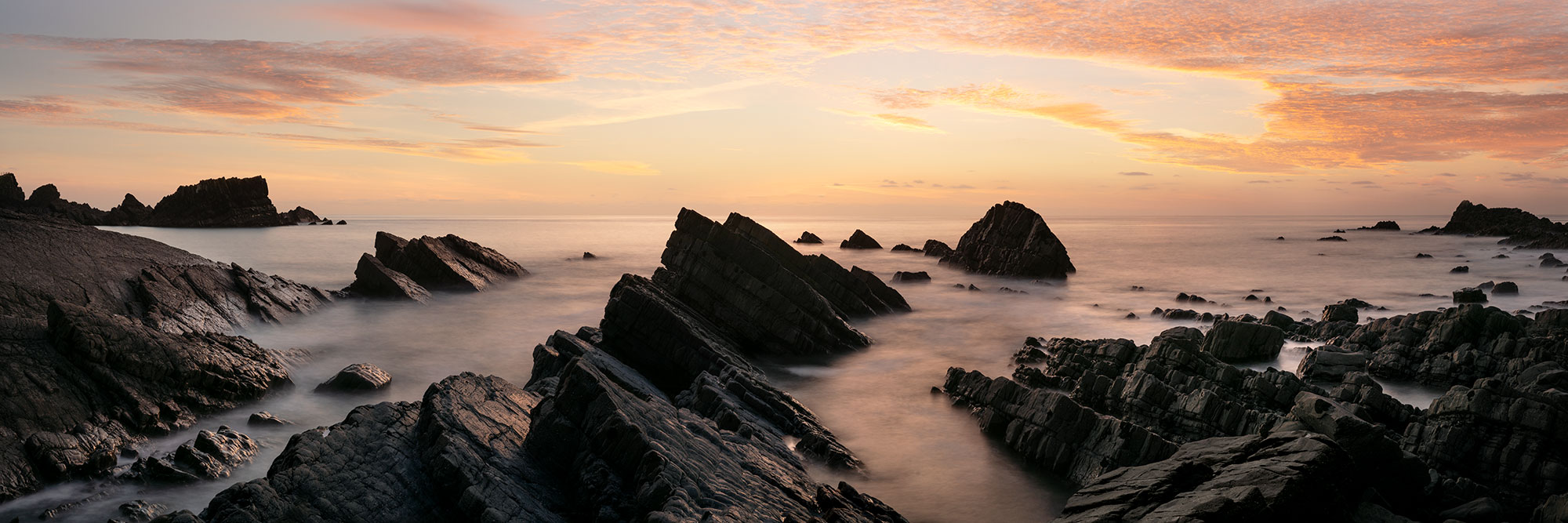 Panorama of Hartland Quay at sunset along the south west coast path in Devon