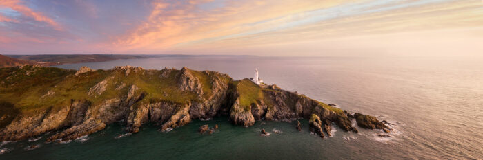 Panorama of start point lighthouse at sunrise along the south west coast path in Devon