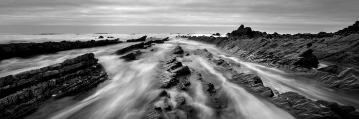 B&W panorama of Welcombe Mouth beach in North Devon