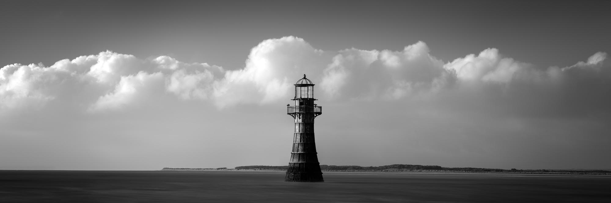 Black and white panorama of Whiteford Lighthouse in Wales