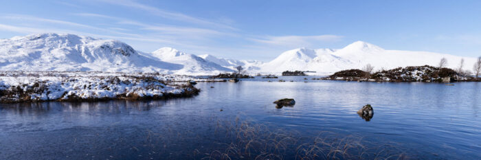 Panorama of Lochan na h-Achlaise covered in snow in winter in Glencoe in the Scottish highlands