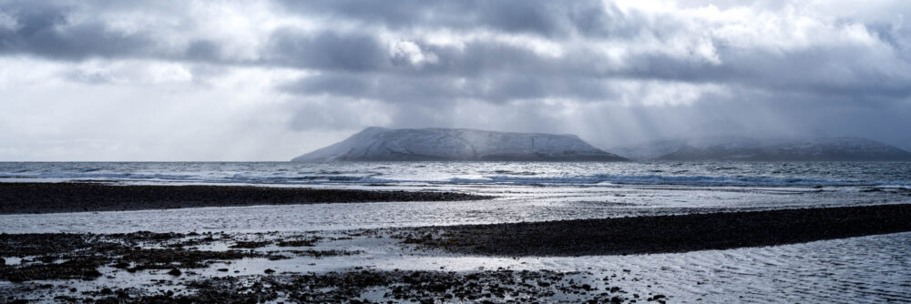 Panorama off the Isle of Arran from Skipness beach in the Scottish highlands