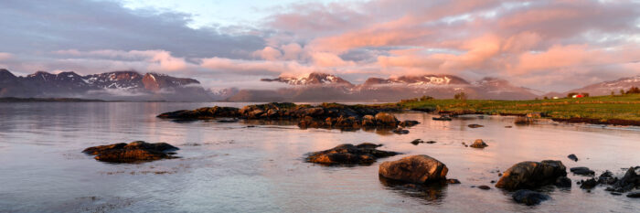 panorama of vestvagoya with a red sunrise in the Lofoten Islands Norway