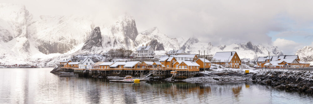 Panorama of the Sakrisoy yellow fishing village and cabins in the Lofoten Islands in winter