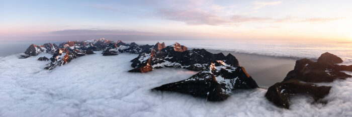 Aerial panorama of the wall of Lofoten during a cloud inversion