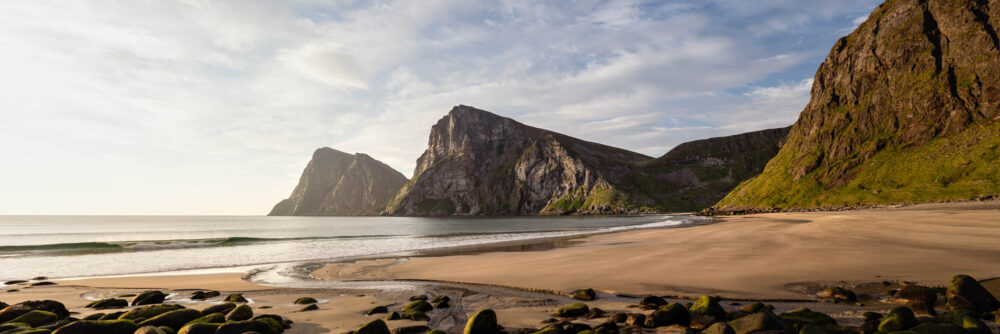 Panorama of Vestervika and Kvalvika beaches on a summers day and the Arctic Ocean in the Lofoten Islands