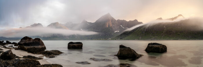 Panorama of Stortinden in Flakstadøya bay in the Lofoten islands as the clouds roll in