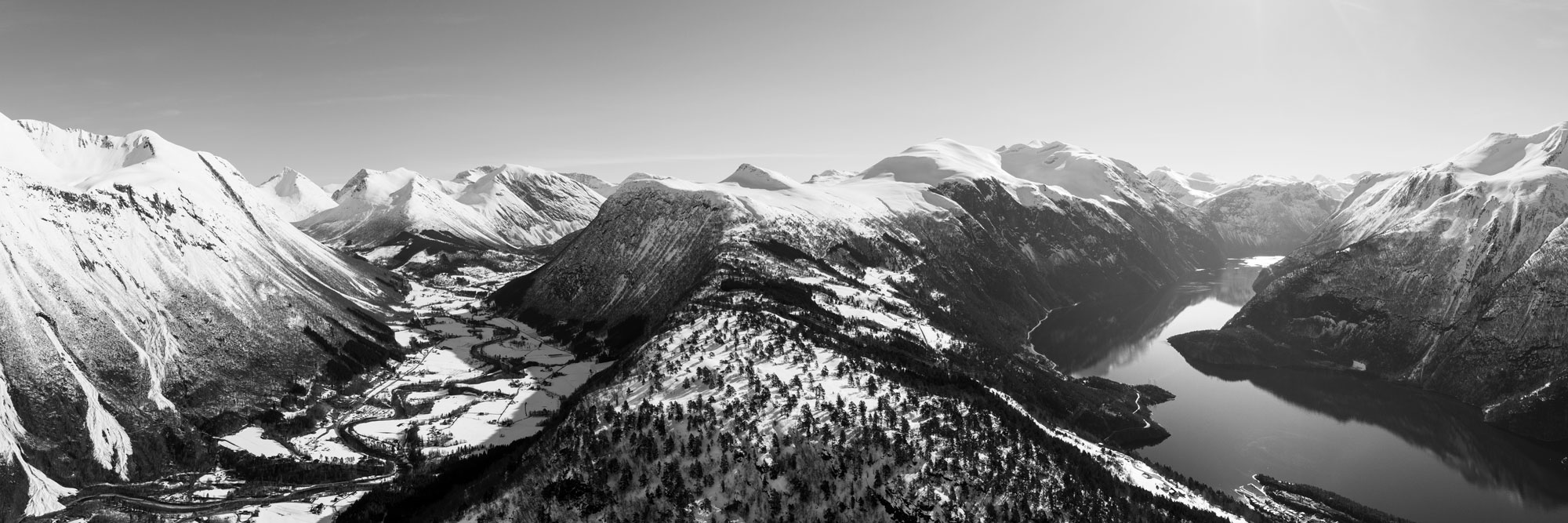 Black and white aerial panorama of a Norwegian Valley and Fjord storfjorden