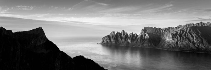 black and white panorama of Ersfjorden and the Oksehornan Devils Teeth on Senja Island in Norway