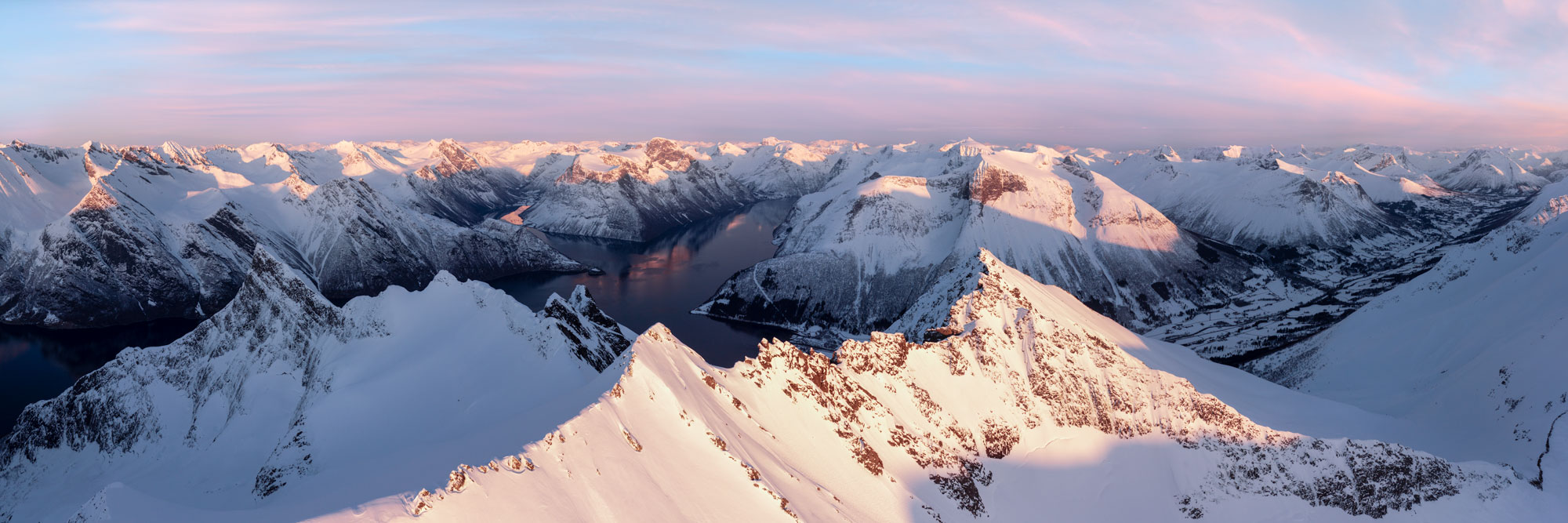 Panorama of a frozen lake Majavatnet in winter in Norway