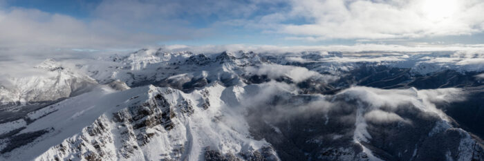 Aerial panorama of the Pico De Europa mountains in Spain covered in snow