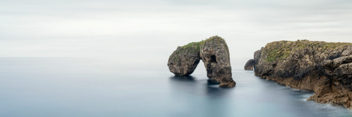 Panorama of a natural arch on the Austurias coast in Spain