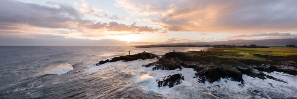 Aerial Panorama of the Illa Pancha Lighthouse at sunrise in Spain