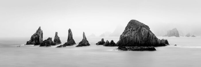 B&W panorama of the Sharp Fractured quarts rocks in Gueirua on the coast of Asturias in Spain
