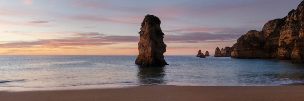 Panorama of the Praia de Dona Ana at sunrise in the Algarve