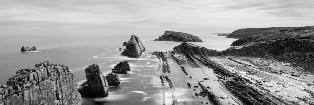 B&W Panorama of the Urros de Liencres coast in north Spain