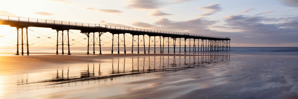 Panorama of the Saltburn Piebeach and Pier at sunset