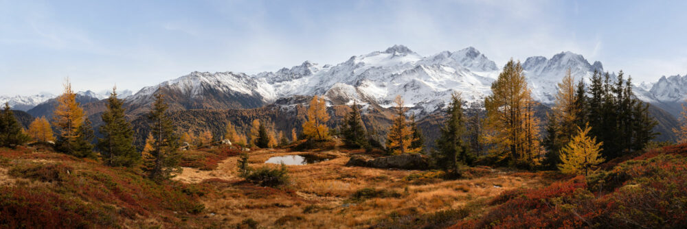 Panorama of Autumn colours along the Six Jeurs hiking route in Lac d'Emosson Switzerland