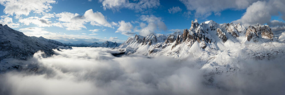 Aerial Panorama above the Vallée de la Clarée in winter during a cloud inversion