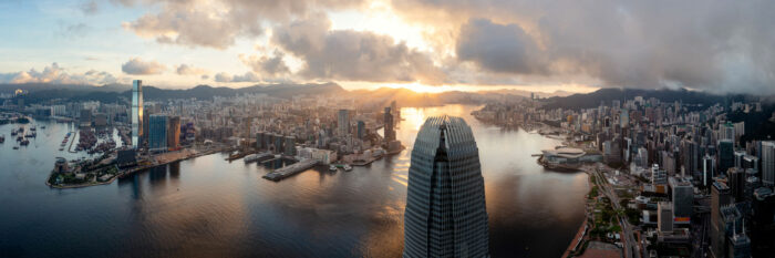 Aerial panorama of the Hong Kong skyline and IFC at sunrise