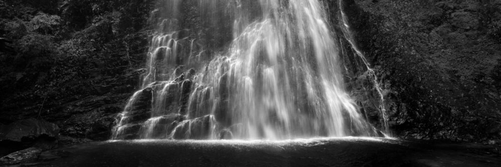 Black and white panorama of the Love Waterfall on a misty day in Sapa, Vietnam