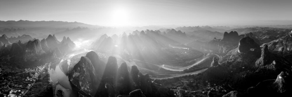 Monochrome areal panorama of the winding river Li Flowing through the mountains of Xingping in Yangshuo, China