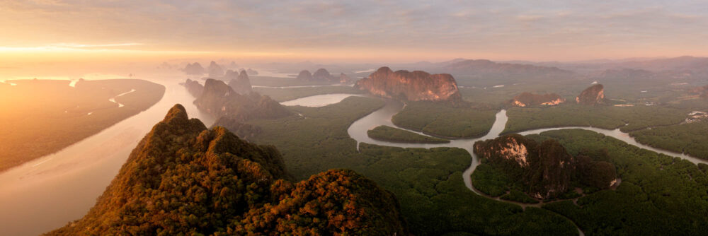 Aerial panorama of Ao Phang Nha winding rivers at sunrise in Thailand