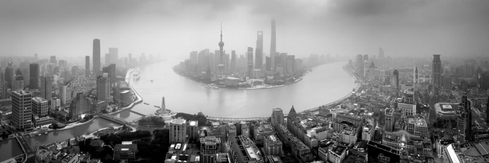 Black and white aerial panorama of the Shanghai Skyline and river on a misty morning in china